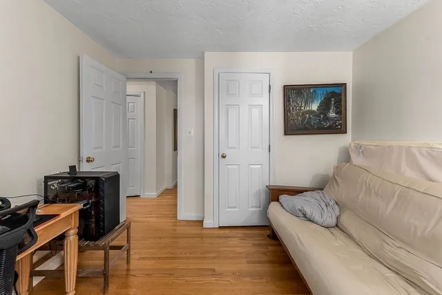 a bedroom with bed and window