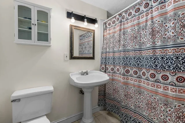 a view of deck with furniture and trees