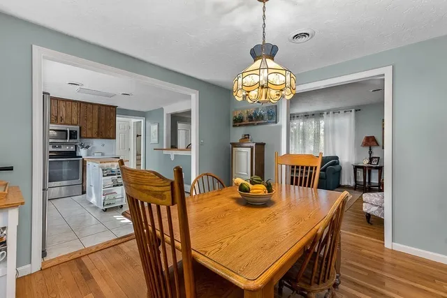 a kitchen with a refrigerator a stove top oven and a sink