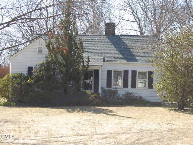 35 Stonybrook Road Norwalk, CT 06851 - Photo 1 of 1 a front view of a house with a yard covered in snow