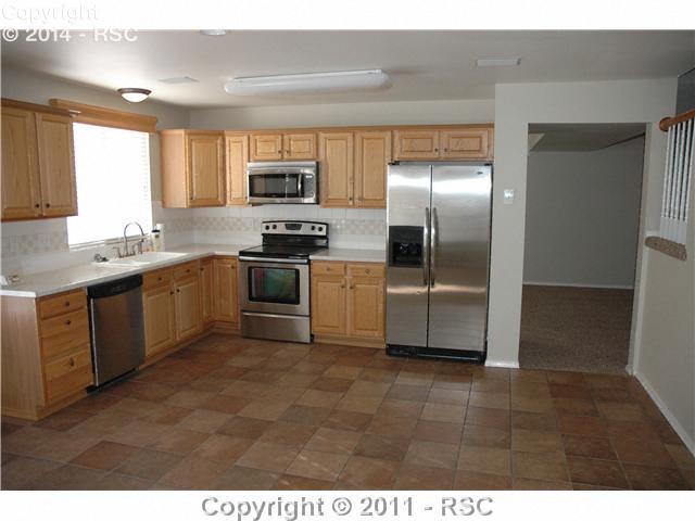 245 Talus Road Monument, CO 80132 - Photo 3 of 16 Spacious Kitchen