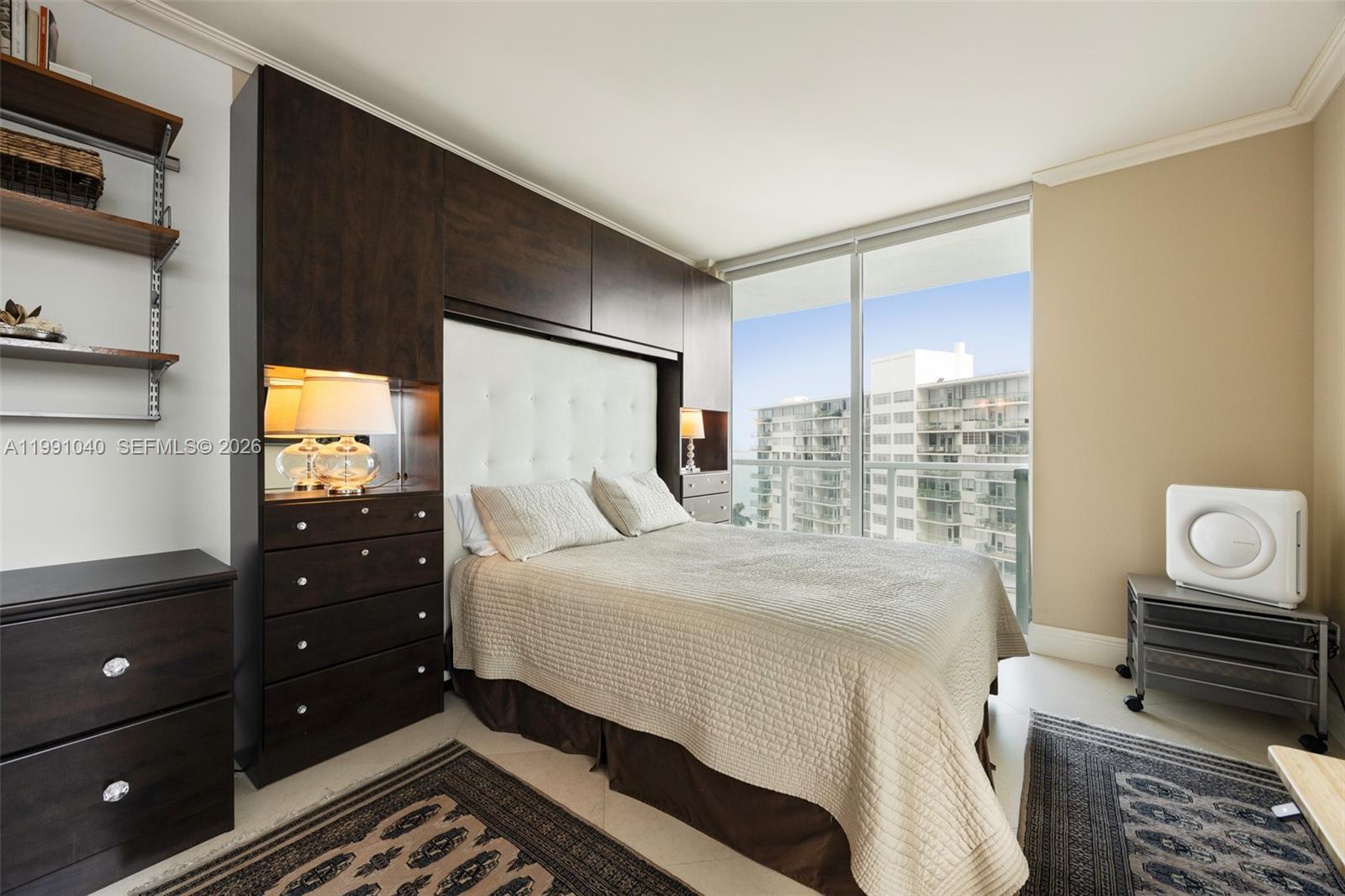 218 Southeast 14th Street, Unit 1007 Miami, FL 33131 - Photo 14 of 32 a bedroom with a bed and a window