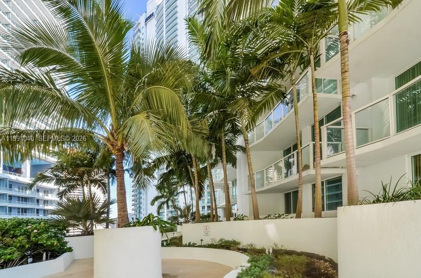 218 Southeast 14th Street, Unit 1007 Miami, FL 33131 - Photo 21 of 32 a view of a palm trees in front of a building