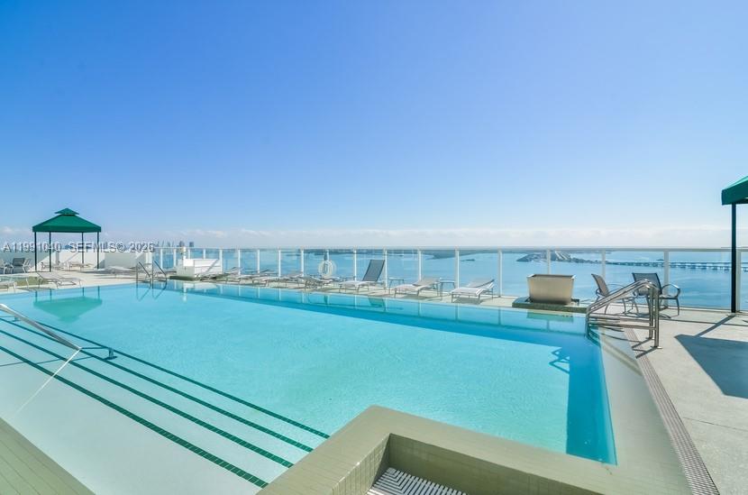 218 Southeast 14th Street, Unit 1007 Miami, FL 33131 - Photo 25 of 32 a view of a living room and kitchen