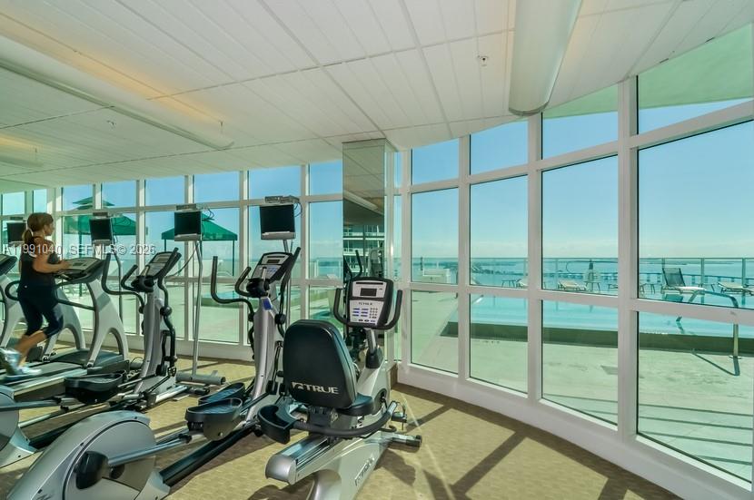 218 Southeast 14th Street, Unit 1007 Miami, FL 33131 - Photo 26 of 32 a view of a room with gym equipment