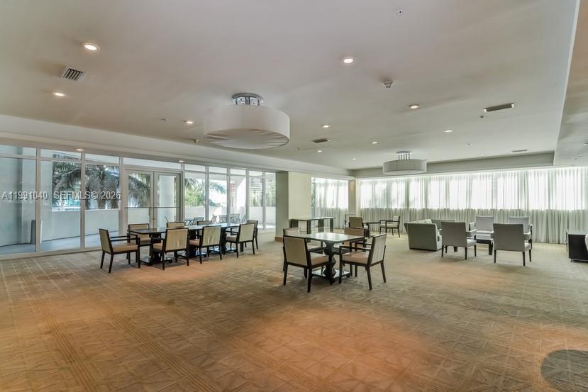 218 Southeast 14th Street, Unit 1007 Miami, FL 33131 - Photo 27 of 32 a view of a dining room with furniture window and outside view