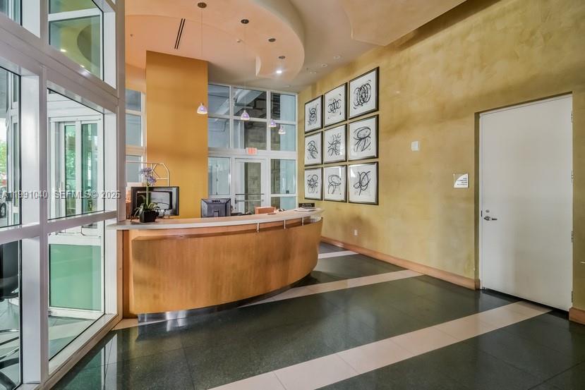 218 Southeast 14th Street, Unit 1007 Miami, FL 33131 - Photo 30 of 32 a living room with furniture stove and a large window
