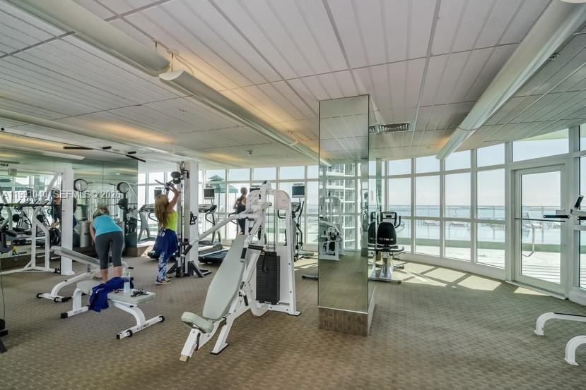218 Southeast 14th Street, Unit 1007 Miami, FL 33131 - Photo 32 of 32 a view of a room with gym equipment