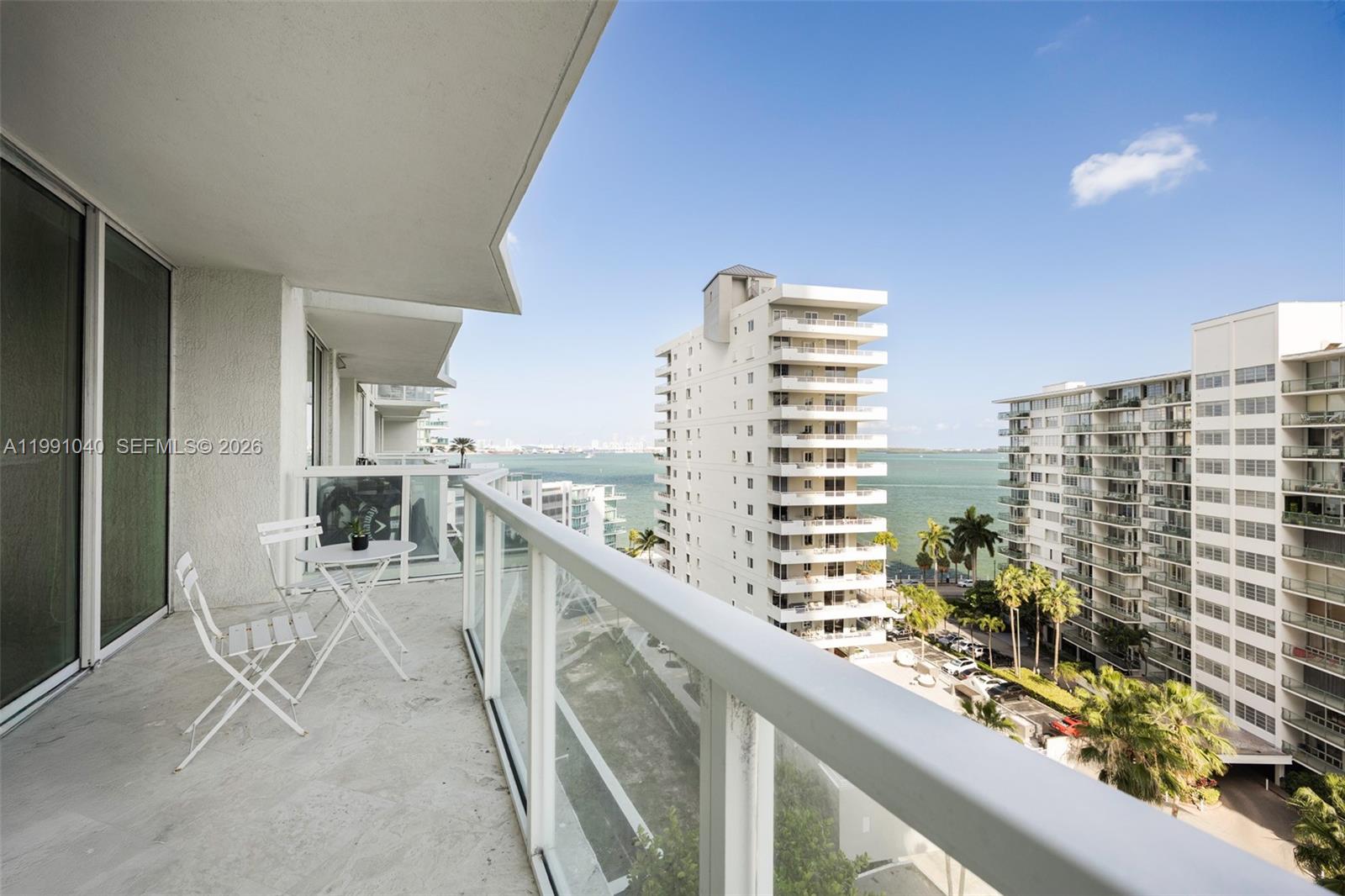 218 Southeast 14th Street, Unit 1007 Miami, FL 33131 - Photo 7 of 32 a view of a balcony with outdoor seating