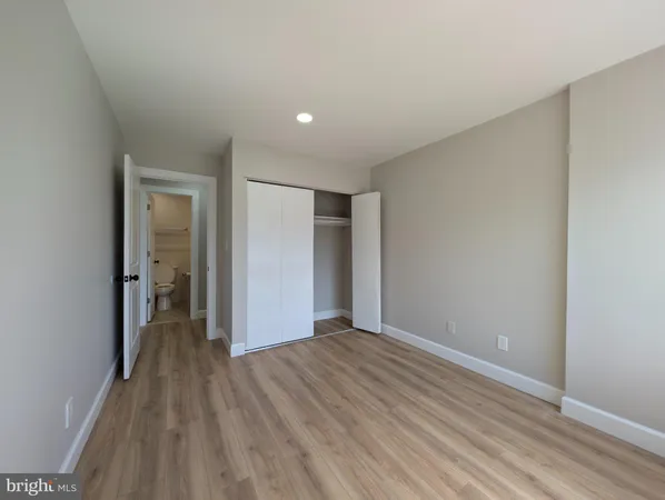 a view of hallway with wooden floor
