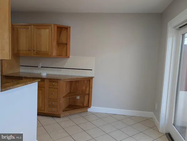 a view of an entryway with kitchen