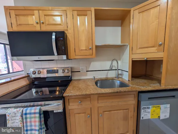 a kitchen with a stove and a sink