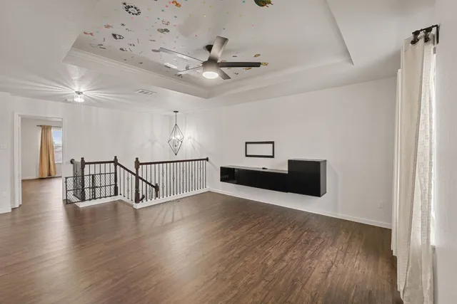 a view of livingroom with hardwood floor and ceiling fan