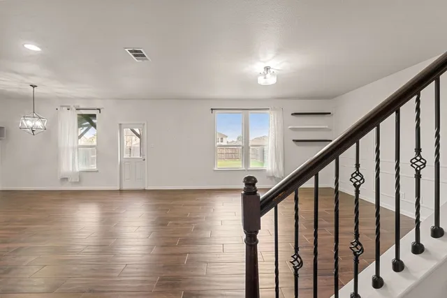 a view of an entryway with wooden floor
