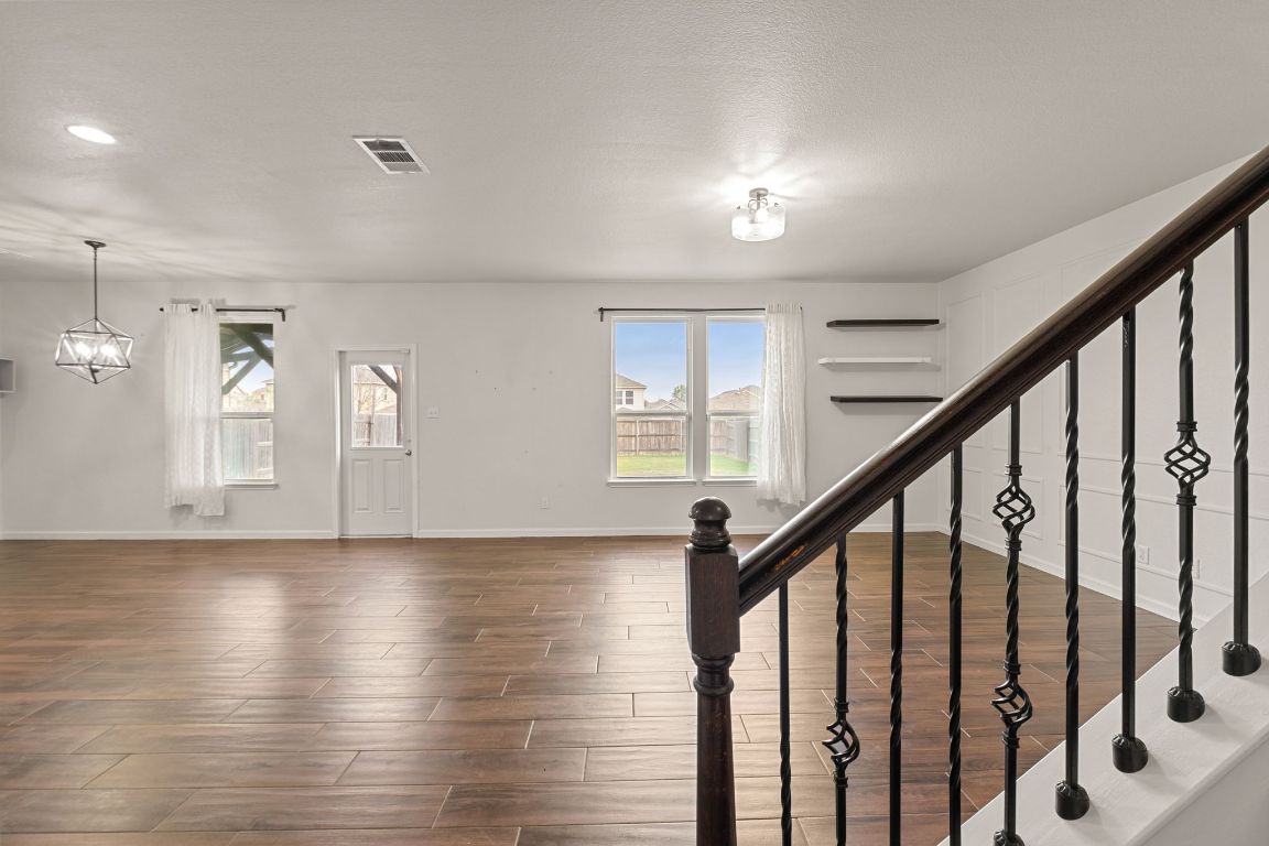 240 Nectar Drive Buda, TX 78610 - Photo 8 of 37 a view of an entryway with wooden floor