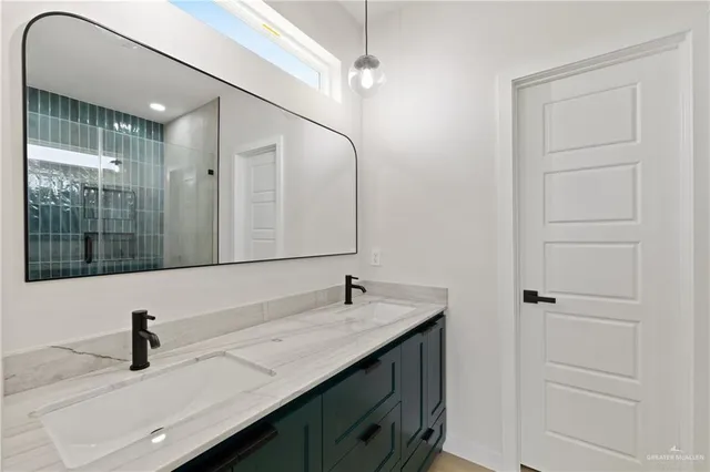 a bathroom with a sink and a mirror