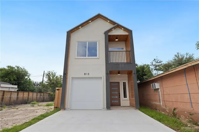 a front view of a house with a garage