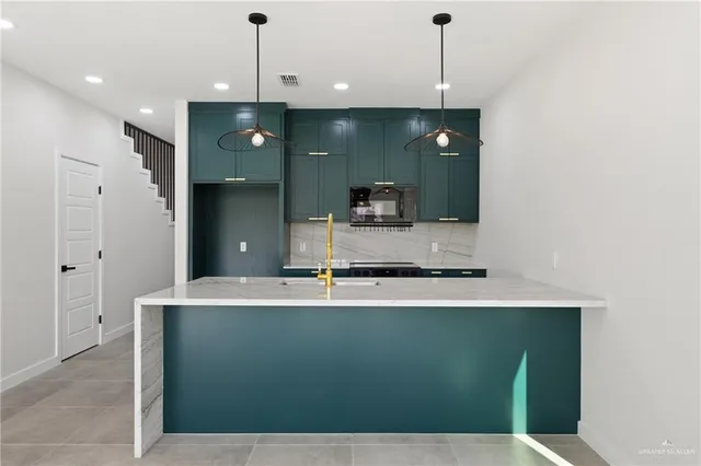 a bathroom with a sink a large mirror and a shower