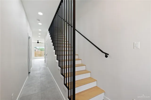 a view of a hallway with staircase