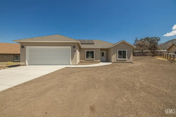 a front view of a house with a garage