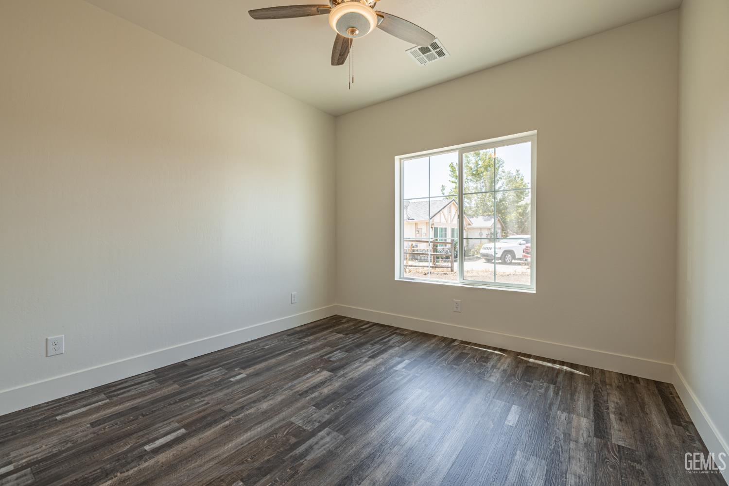 Undisclosed Address Tehachapi, CA 93561 - Photo 16 of 20 wooden floor in an empty room with a window