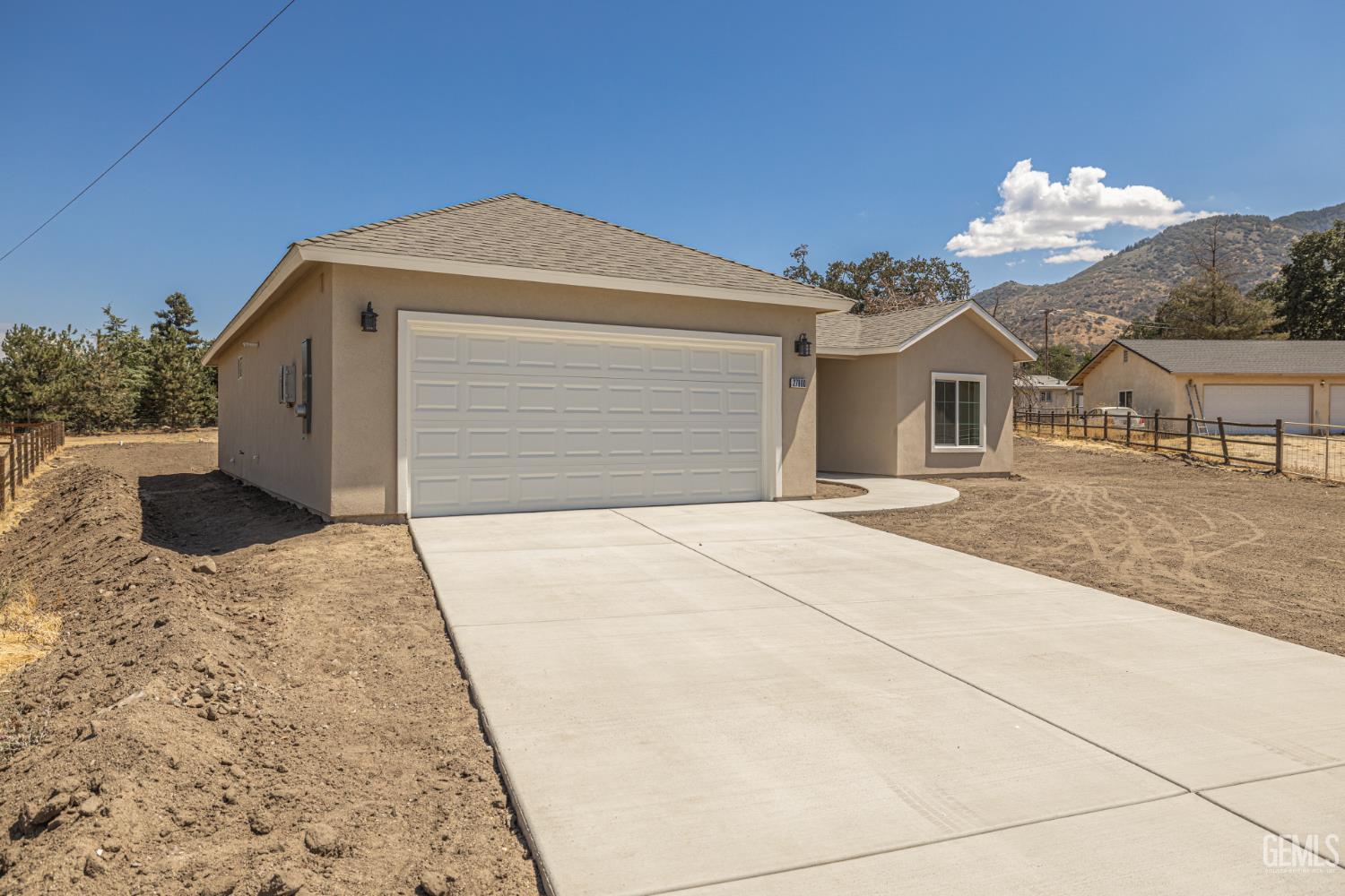 Undisclosed Address Tehachapi, CA 93561 - Photo 2 of 20 a front view of a house with a yard