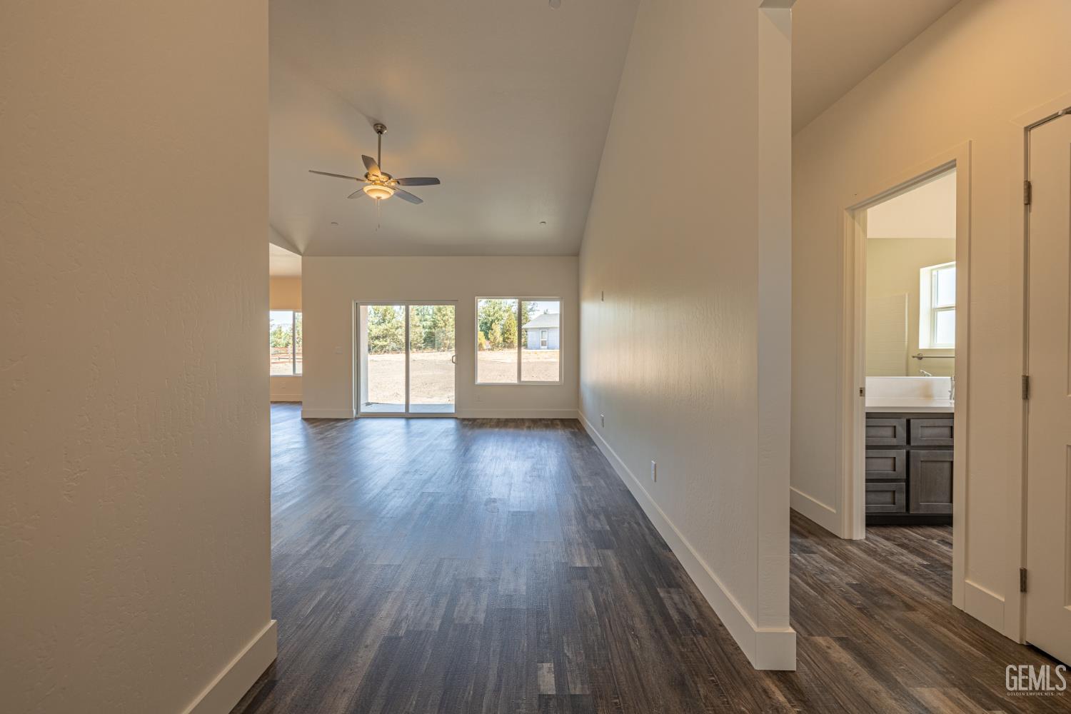 Undisclosed Address Tehachapi, CA 93561 - Photo 4 of 20 wooden floor in an empty room with a window