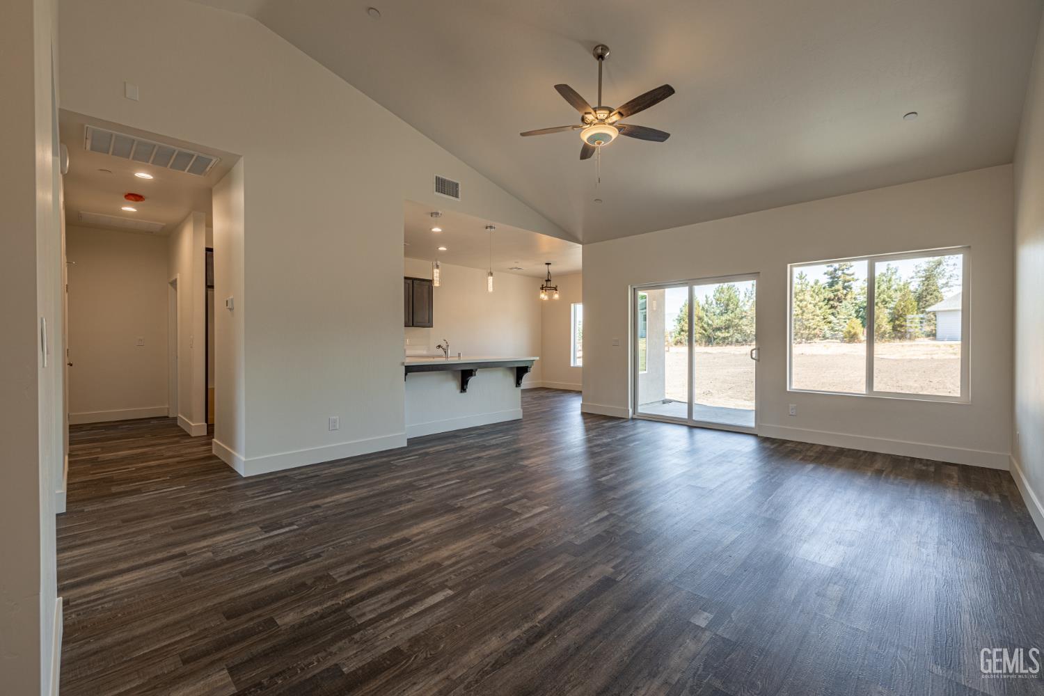Undisclosed Address Tehachapi, CA 93561 - Photo 5 of 20 a view of an empty room with wooden floor and a window