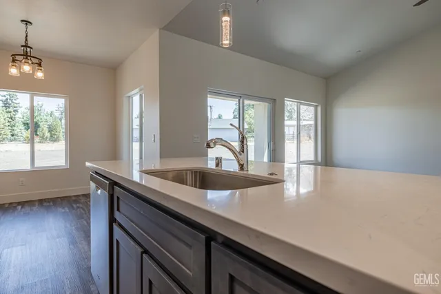 a close view of a sink a counter space and a window