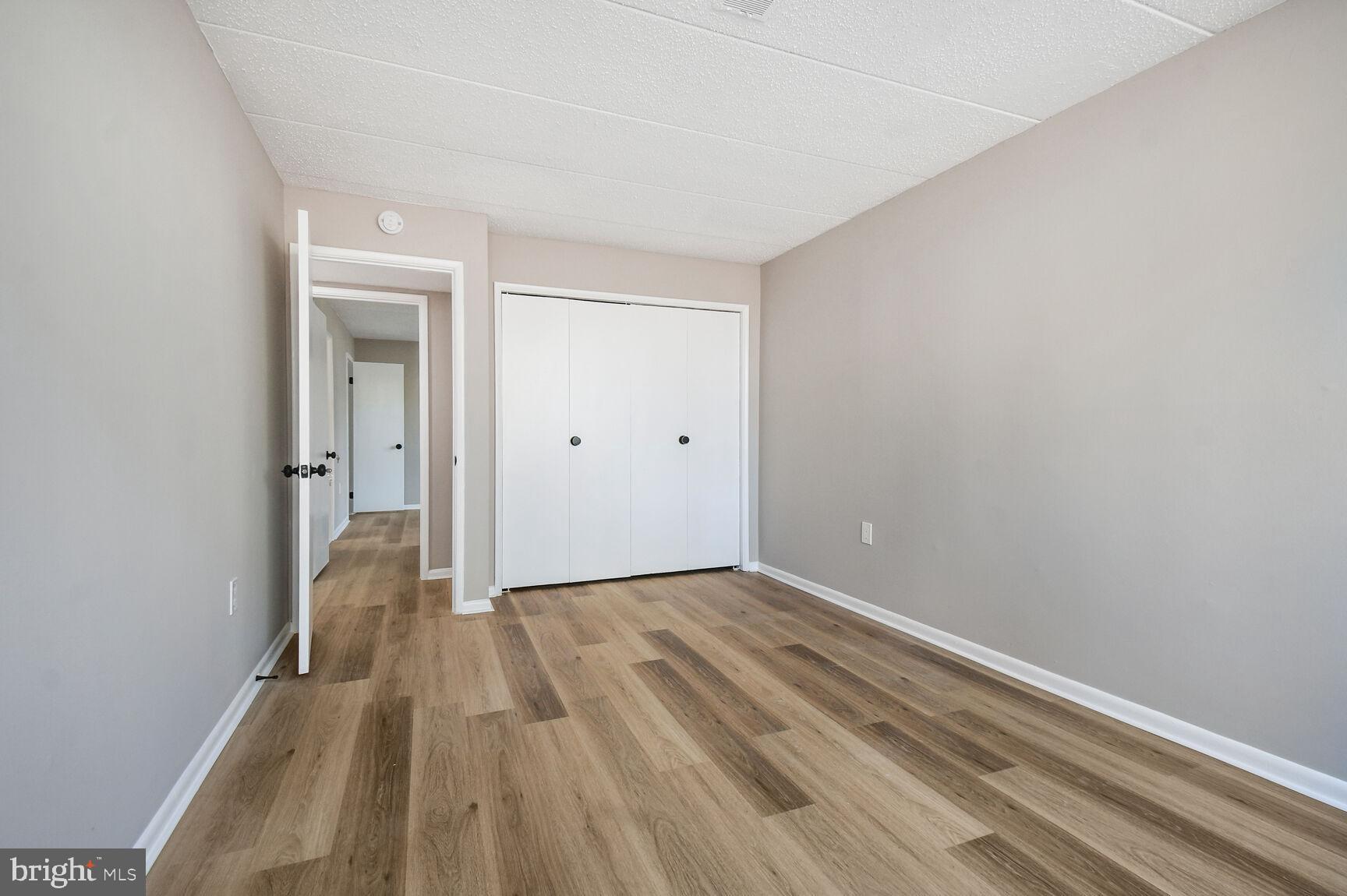 1804 Metzerott Road, Unit 106 Silver Spring, MD 20903 - Photo 14 of 15 wooden floor in a empty room