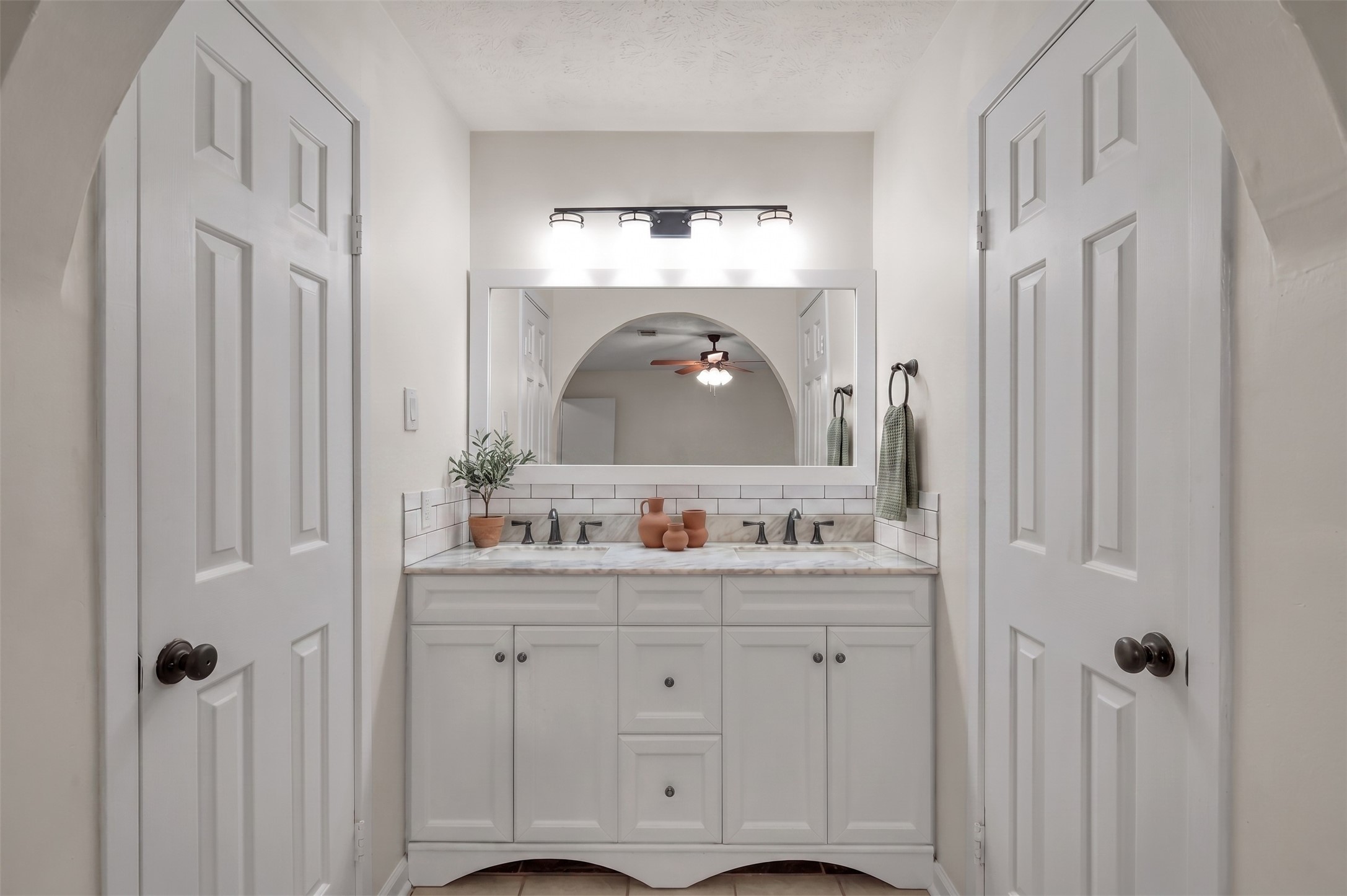 12224 Gun Oak Place Spring, TX 77380 - Photo 23 of 37 Primary Bathroom Featuring Dual Sinks, Generous Counter Space, and Walk In Closet