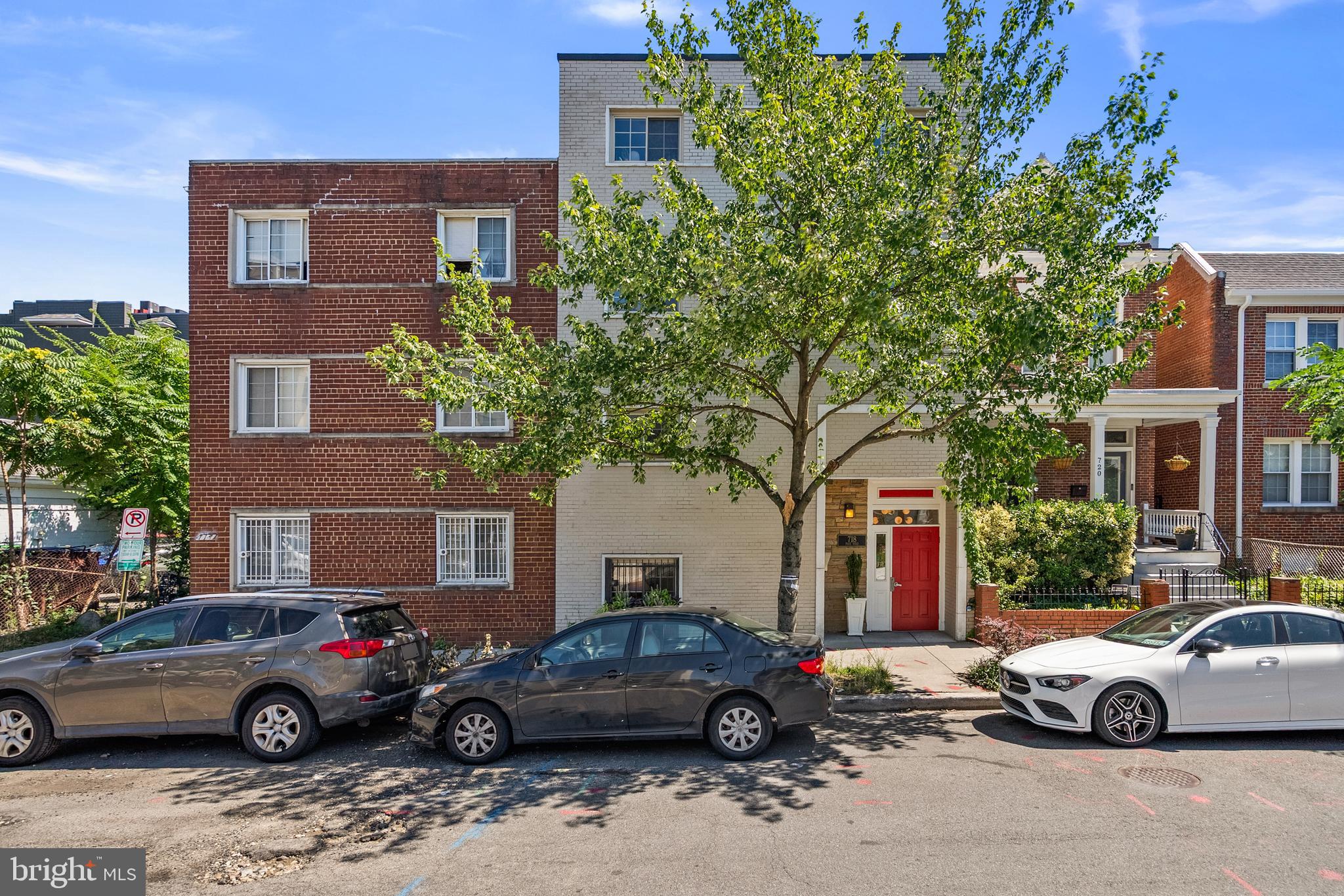 718 Park Road Northwest, Unit 1 Washington, DC 20010 - Photo 1 of 28 a view of a cars parked in front of a brick building