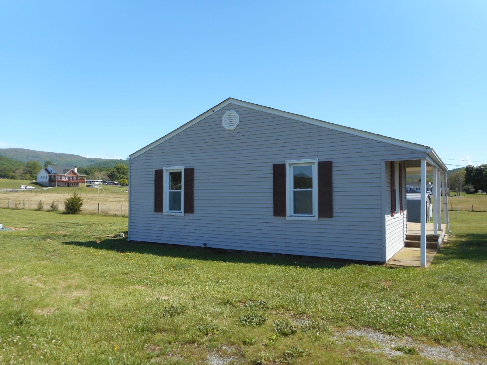 18874 Huckleberry Road Elkton, VA 22827 - Photo 5 of 23 a house view with a garden space