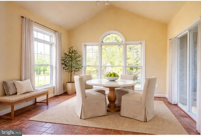 a dining room with furniture a window and a livingroom