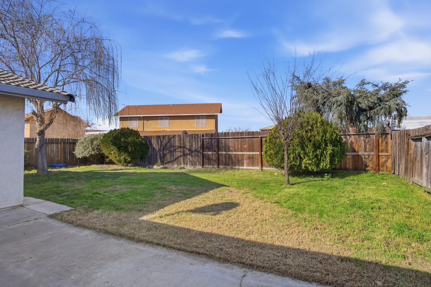 1429 Don Pedro Road Ceres, CA 95307 - Photo 18 of 21 a view of a backyard with large trees