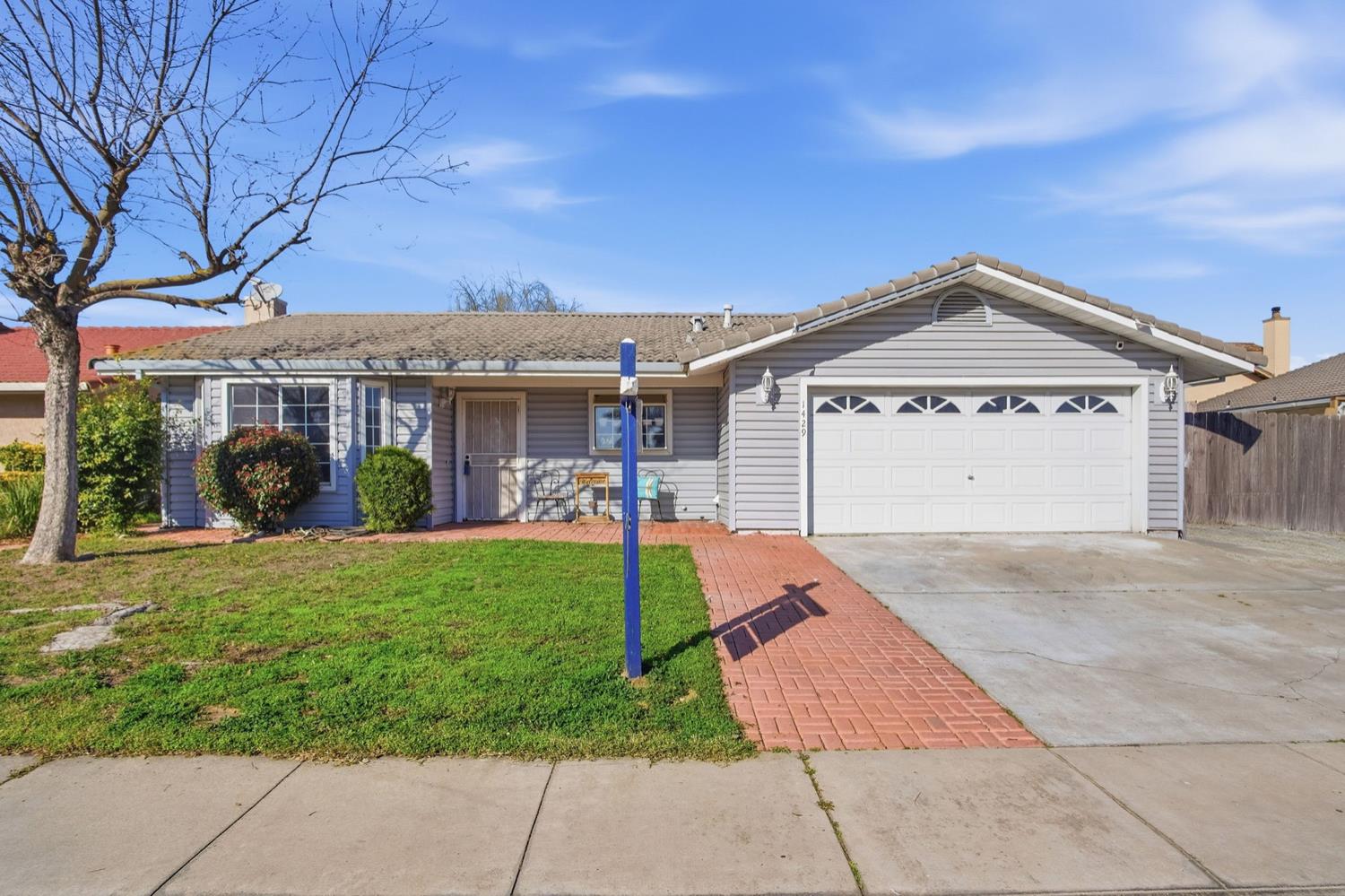 1429 Don Pedro Road Ceres, CA 95307 - Photo 2 of 21 a front view of a house with garden