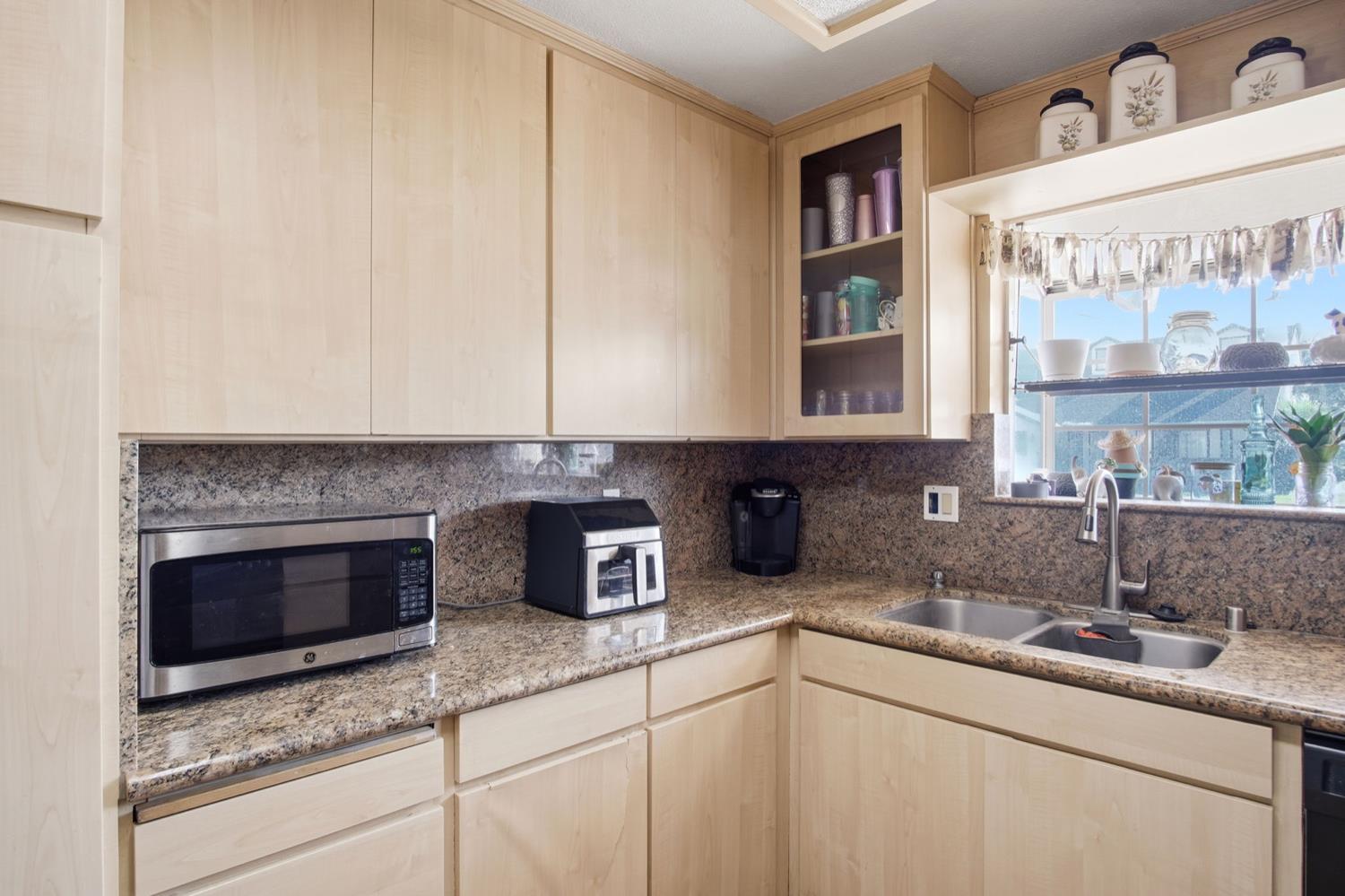1429 Don Pedro Road Ceres, CA 95307 - Photo 6 of 21 a kitchen with stainless steel appliances granite countertop a sink and a granite counter tops