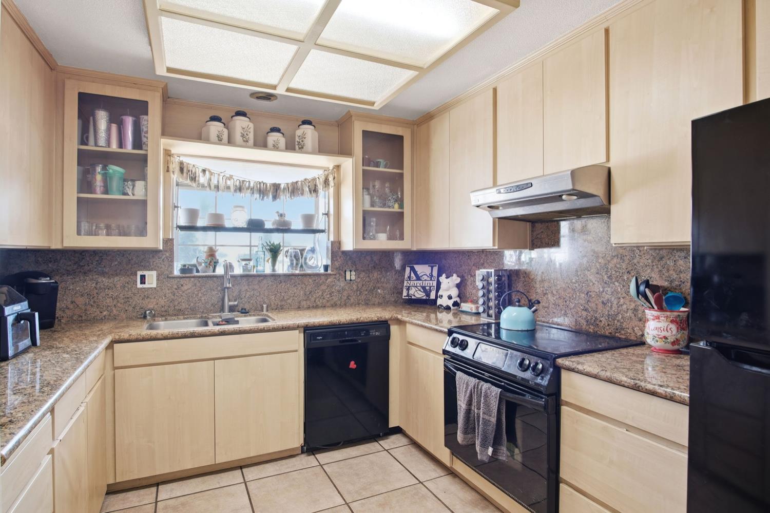 1429 Don Pedro Road Ceres, CA 95307 - Photo 7 of 21 a kitchen with a sink stove and cabinets