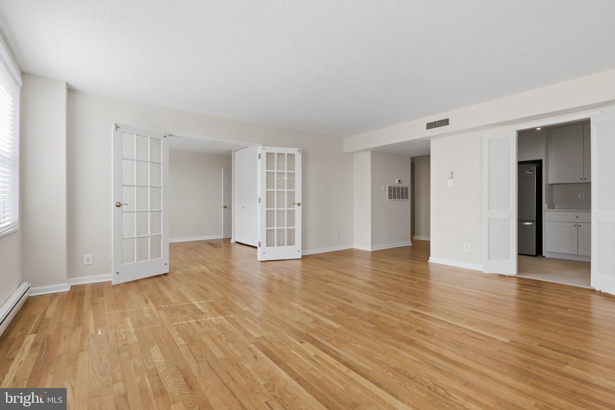 1101 St Paul Street, Unit 1212 Baltimore, MD 21202 - Photo 22 of 36 Spacious, sunlit open living area.