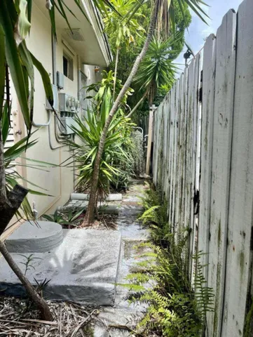 a vase of flowers sitting on a floor