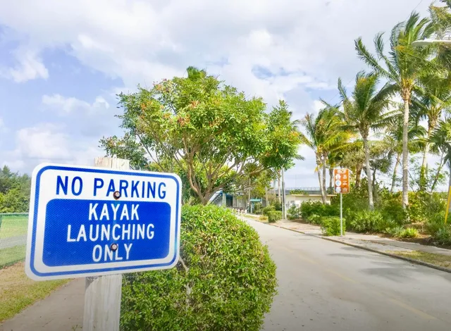 a picture of floor with a white wall and a painting
