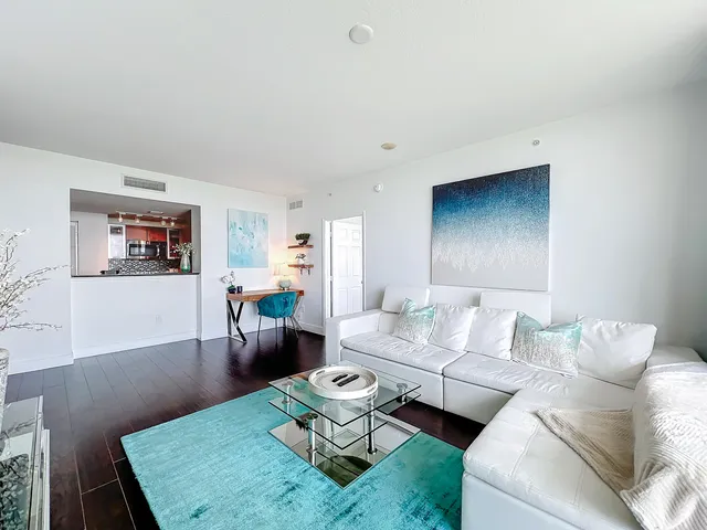 a living room with furniture and a rug