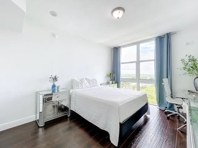 a bed room with a bed and a table