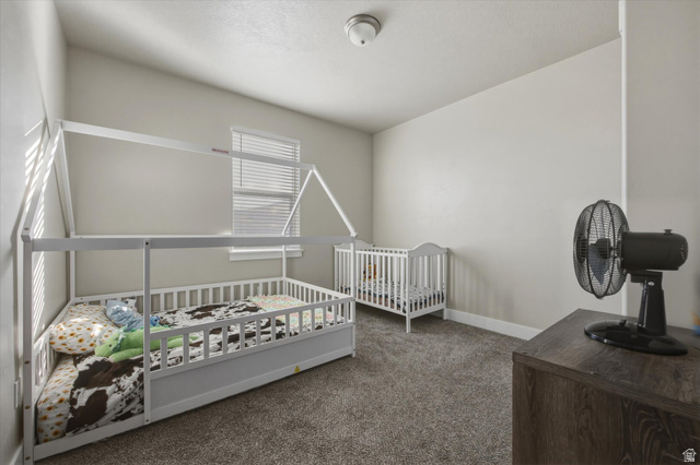 45 Memory Lane Tooele, UT 84074 - Photo 19 of 30 Bedroom with carpet and window