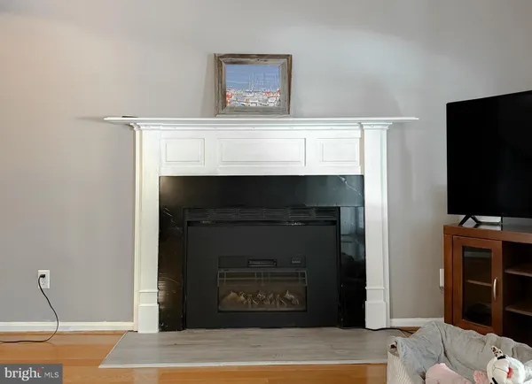 a living room with furniture rug and window