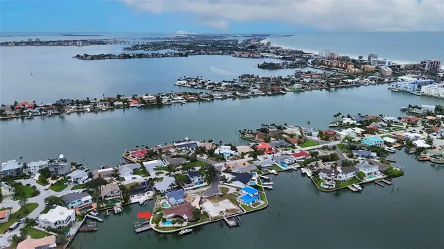 an aerial view of a house with a lake view
