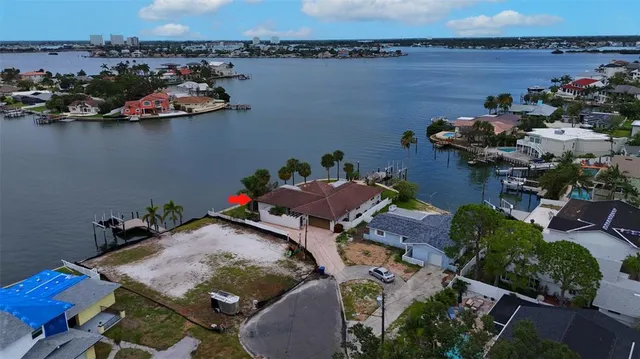a view of a backyard with sitting area