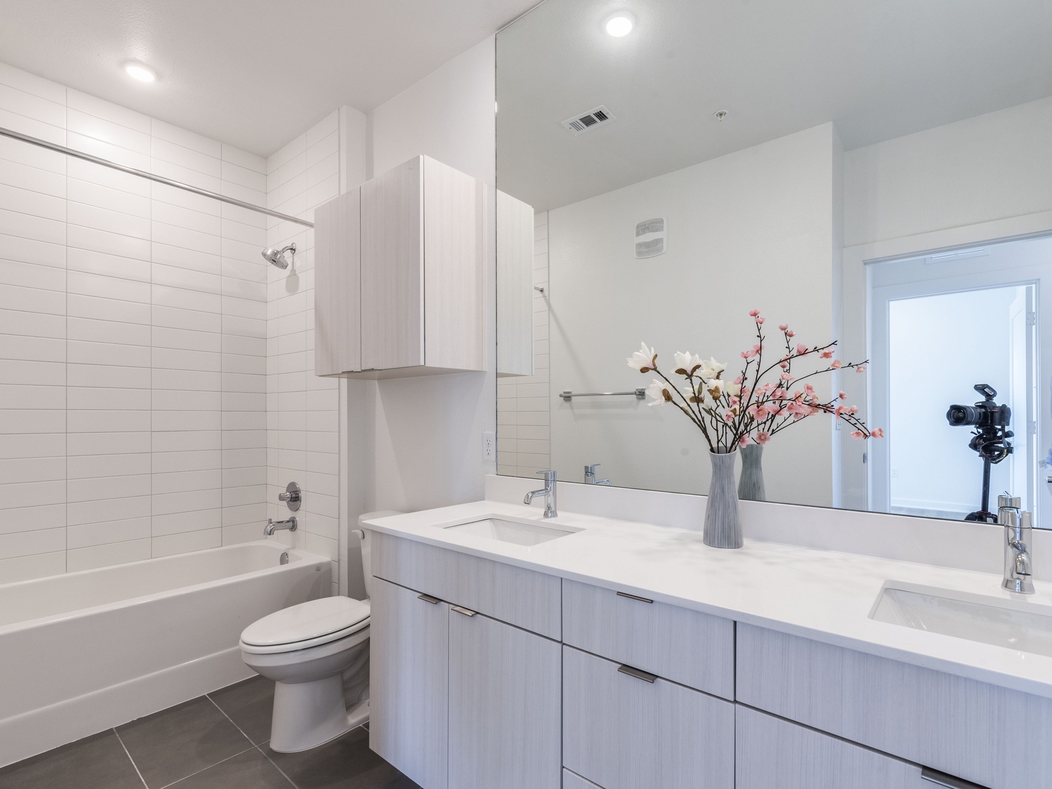 4802 South Congress Avenue, Unit 310 Austin, TX 78745 - Photo 11 of 37 Bathroom with double vanity, tile flooring, and a tub / shower combination