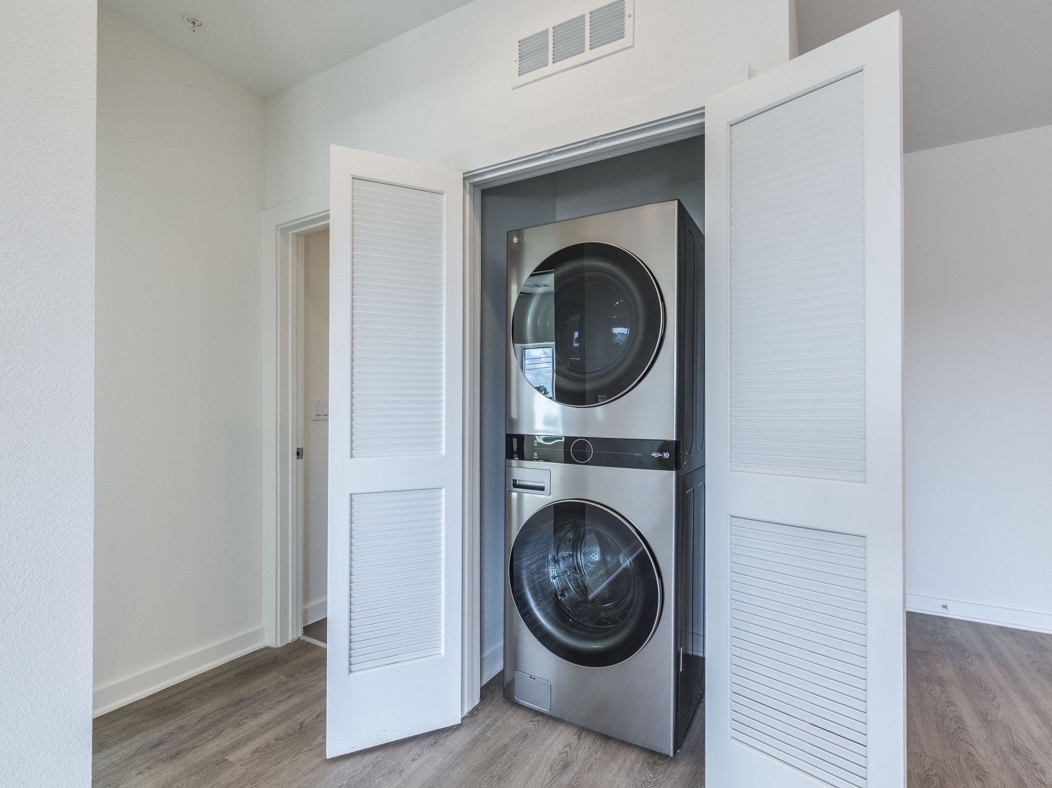 4802 South Congress Avenue, Unit 310 Austin, TX 78745 - Photo 15 of 37 Laundry area with stacked washer and clothes dryer