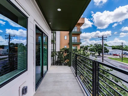 a view of an house with backyard porch and furniture